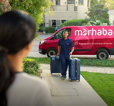 A marhaba representative walking up a garden path towards a house, with a marhaba van behind him